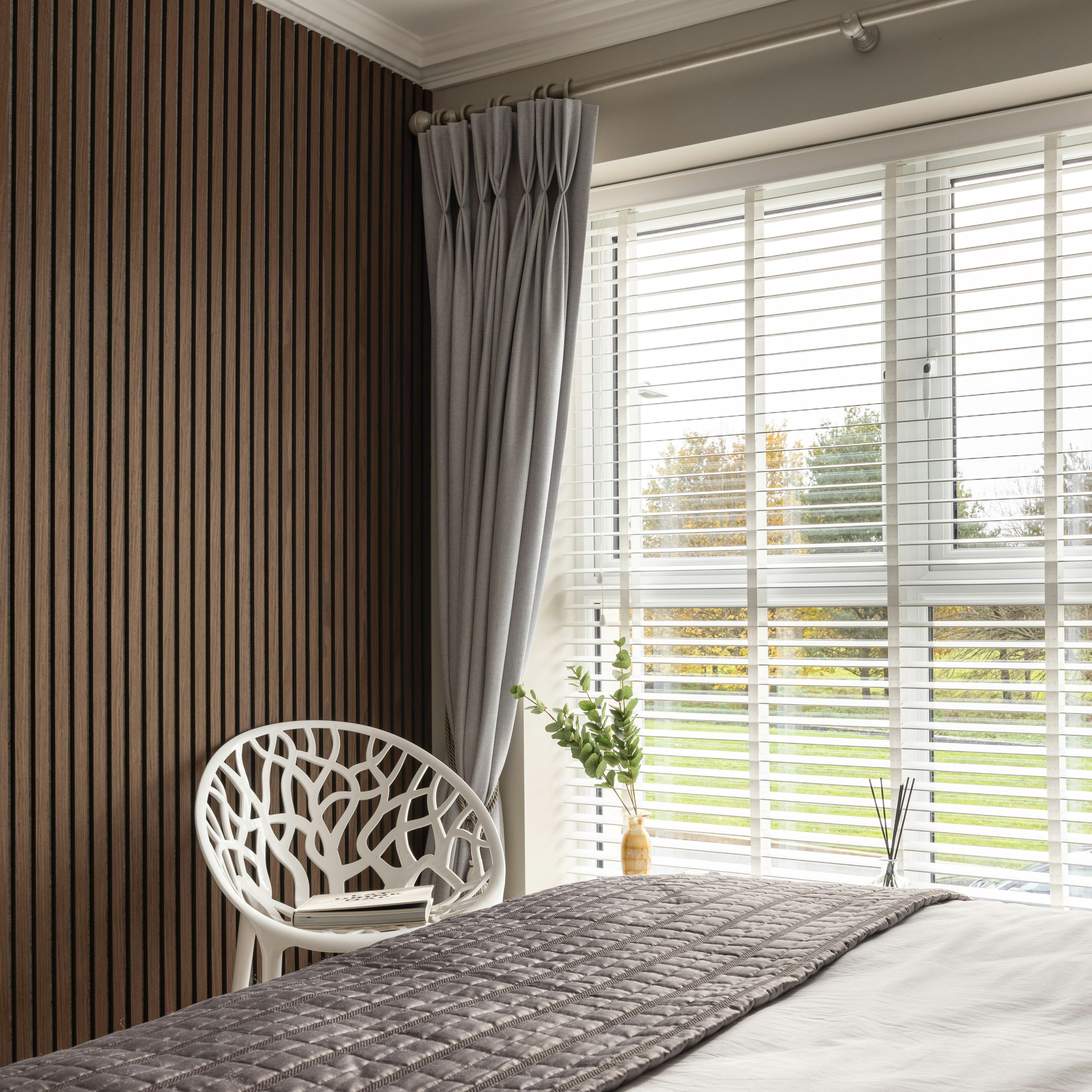 Bedroom with Bed and Chair - Photo by Tile Merchant Ireland on Unsplash