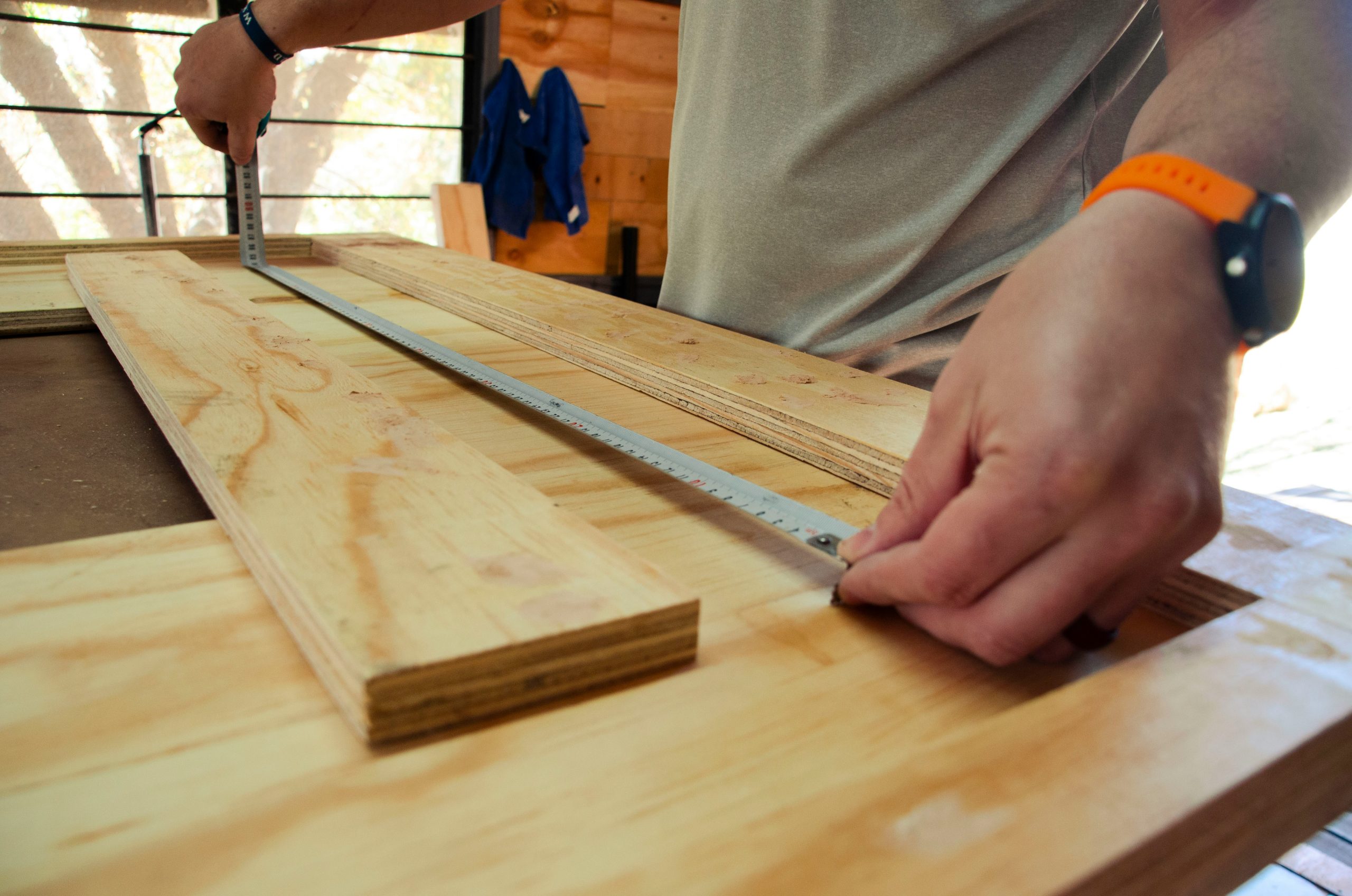 Person holding wooden table - Photo by Ryno Marais on Unsplash